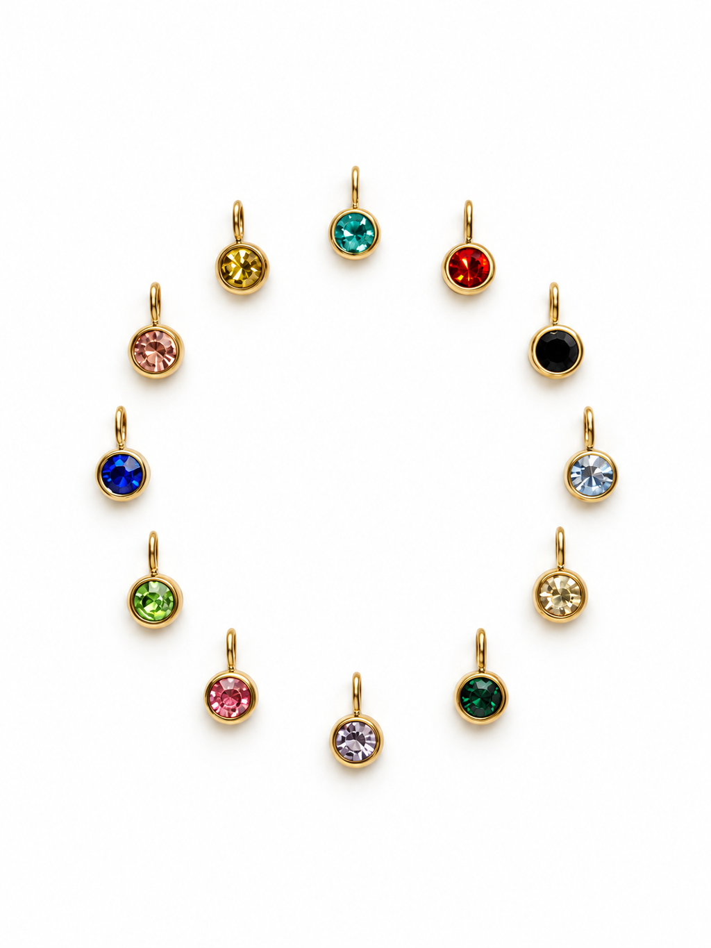 Twelve small gold-tone round birthstone pendants with round faceted rhinestones in assorted colors, arranged in a circular pattern on a white background.
